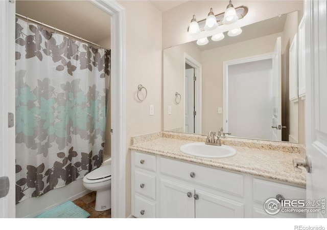 full bathroom with toilet, shower / tub combo, and vanity