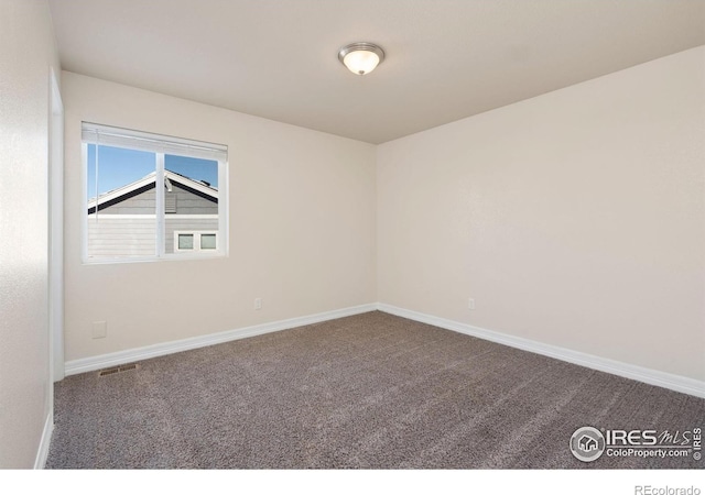 view of carpeted spare room