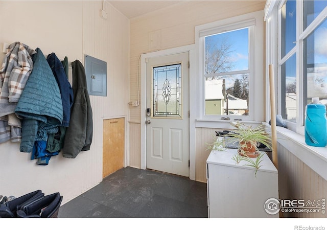 entrance to property with a balcony and electric panel