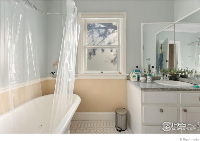 bathroom with tile patterned floors, vanity, and shower / tub combo with curtain