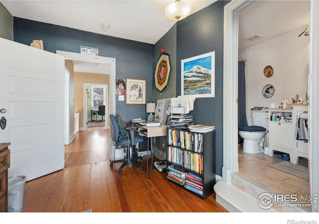 office area with wood-type flooring