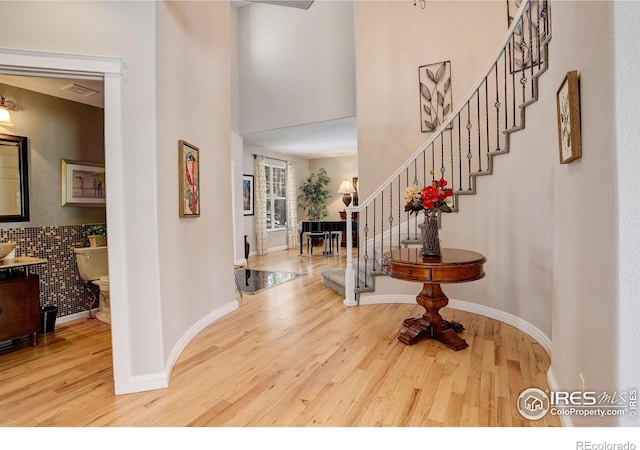 entryway with hardwood / wood-style flooring