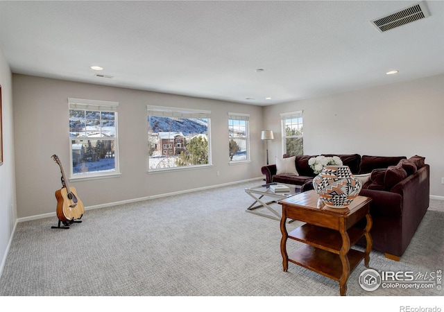 living room featuring light carpet