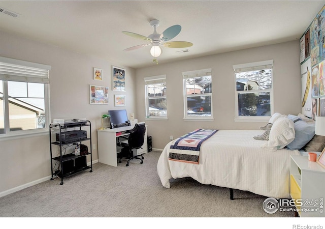 bedroom with light carpet and ceiling fan