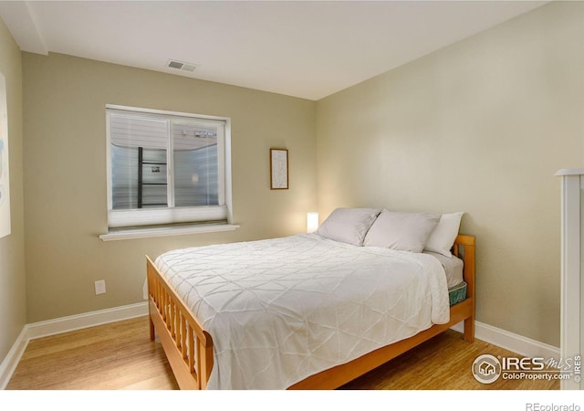 bedroom featuring light wood-type flooring