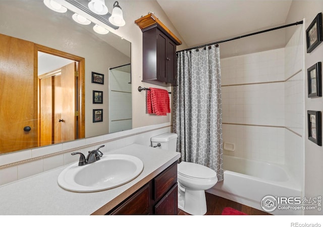 full bathroom with toilet, vanity, shower / tub combo, and tasteful backsplash