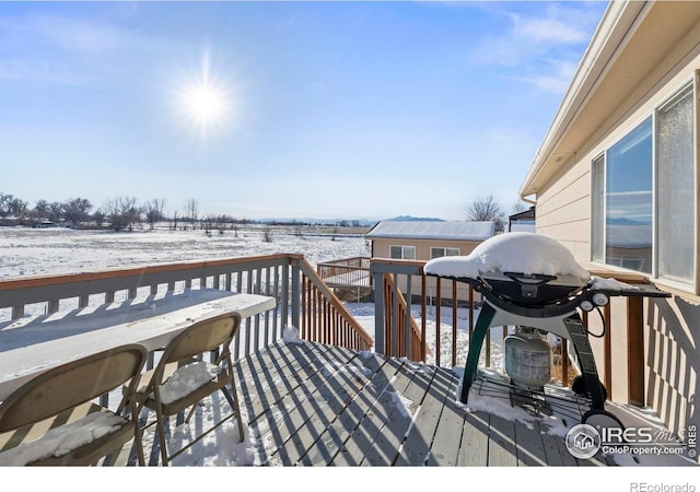 view of snow covered deck