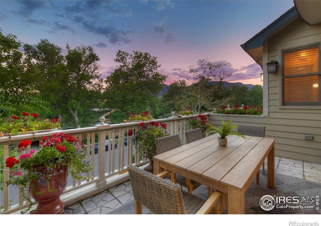 view of balcony at dusk