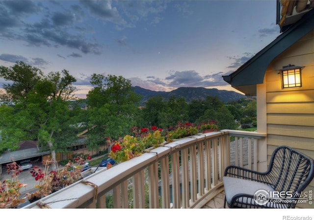 balcony at dusk with a mountain view