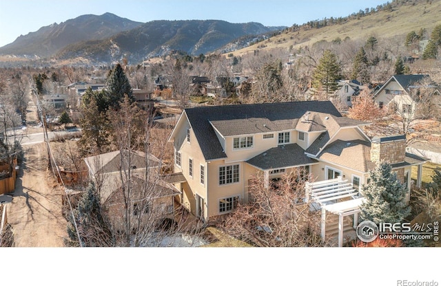 drone / aerial view featuring a mountain view