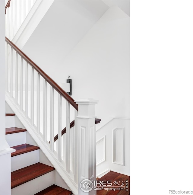 staircase featuring hardwood / wood-style floors