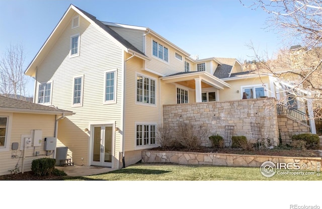 back of property featuring french doors