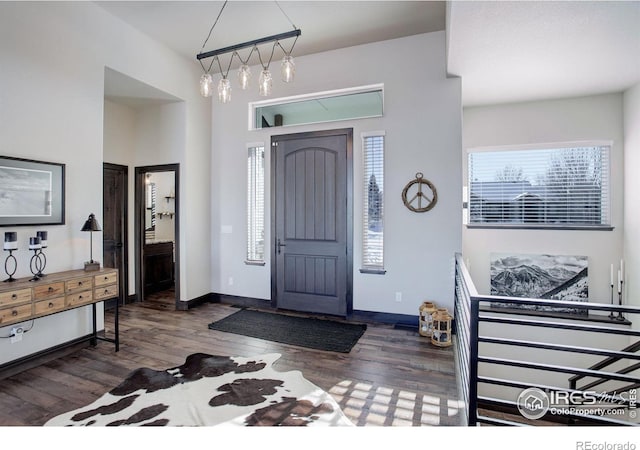 foyer with dark hardwood / wood-style floors