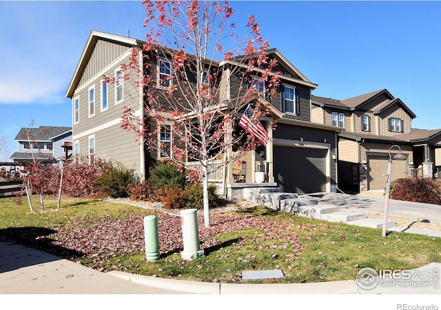 view of front of home featuring a garage and a front lawn