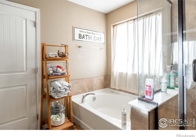 bathroom featuring a tub to relax in