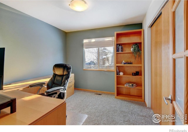 office with carpet floors and baseboards