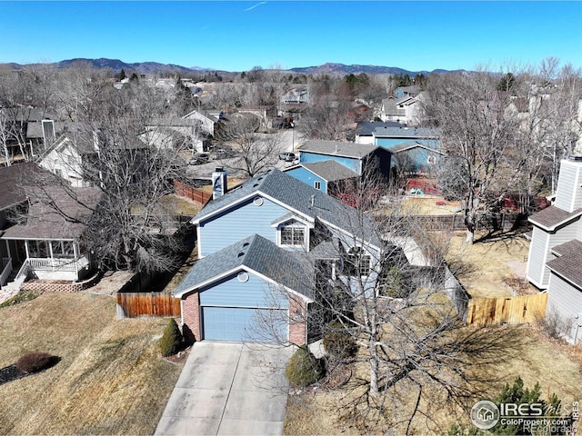 drone / aerial view with a residential view and a mountain view