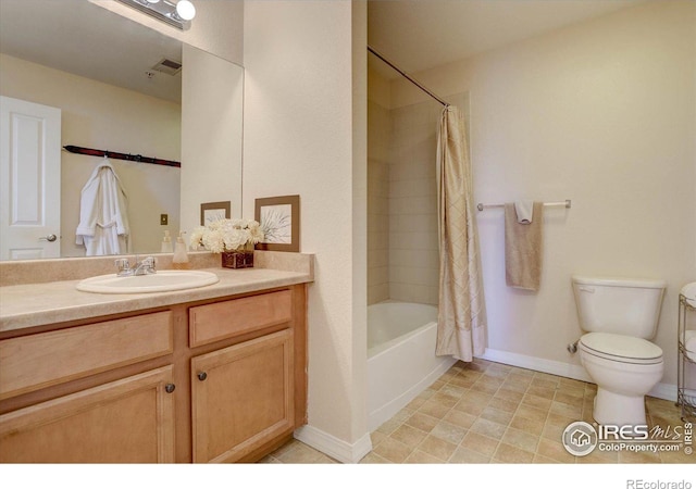 bathroom with shower / bath combo, vanity, toilet, and baseboards