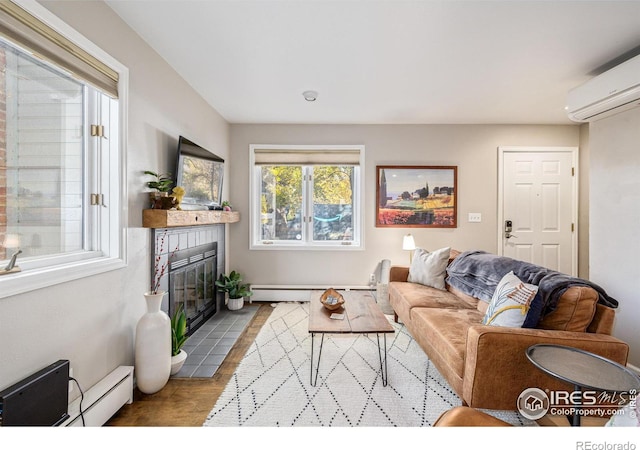 living area with a wall mounted AC, a baseboard radiator, a baseboard heating unit, and a tile fireplace