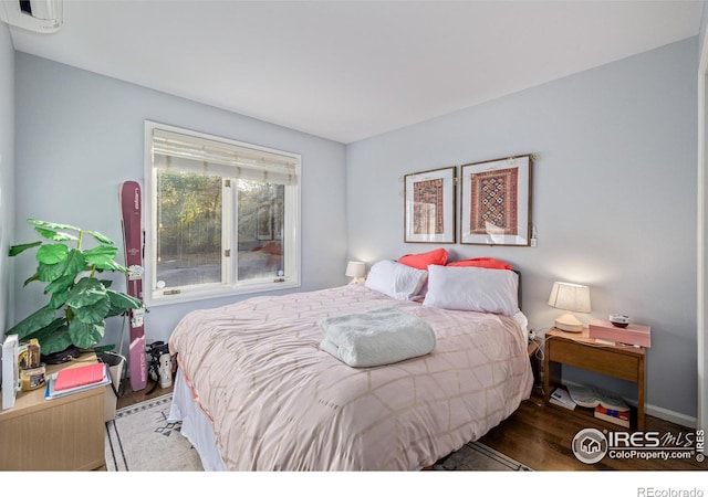 bedroom featuring wood finished floors