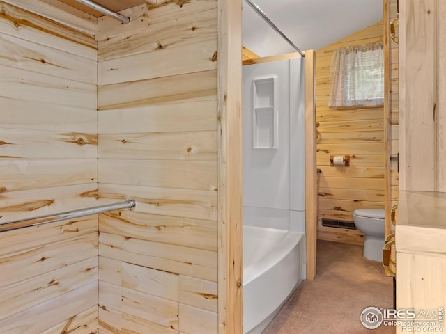 bathroom featuring toilet, independent shower and bath, and wooden walls