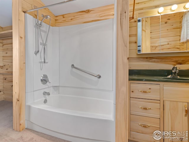 bathroom featuring wooden walls, shower / tub combination, and vanity