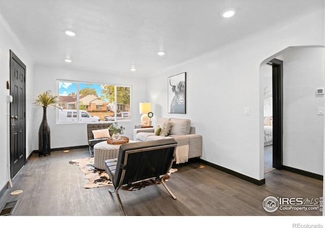 living room featuring dark hardwood / wood-style flooring