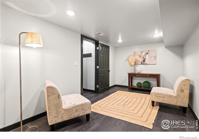 living area with dark hardwood / wood-style floors