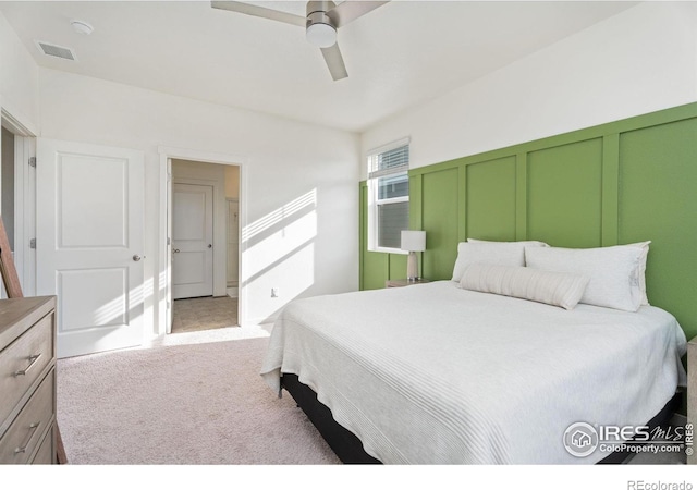 carpeted bedroom with a closet and ceiling fan