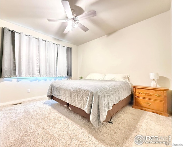 bedroom with ceiling fan and light carpet