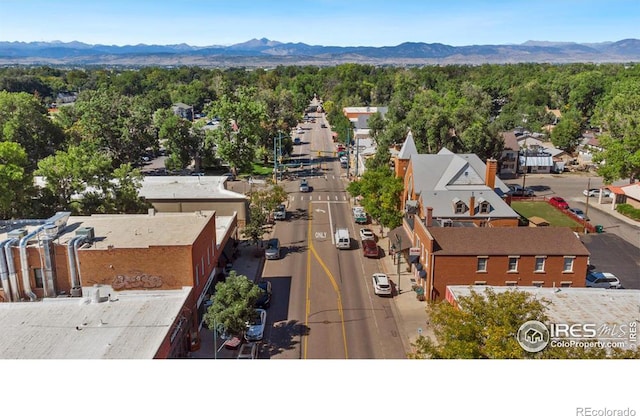 birds eye view of property with a mountain view