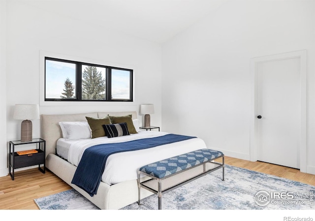 bedroom with hardwood / wood-style flooring