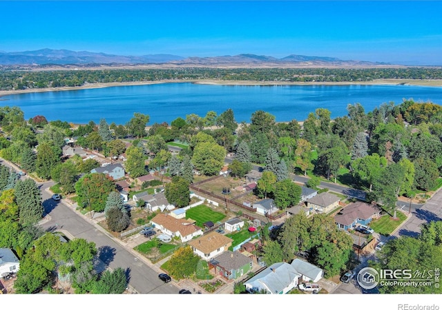 bird's eye view featuring a water and mountain view