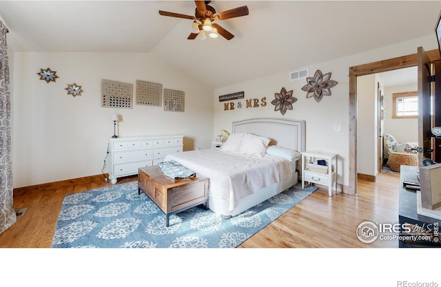 bedroom with lofted ceiling, light wood-type flooring, and ceiling fan