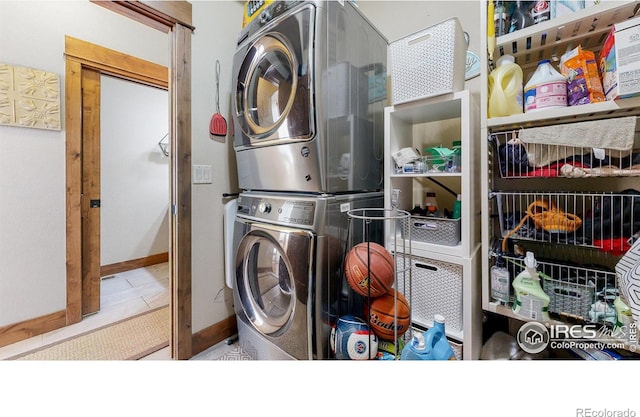 laundry area with stacked washer and dryer