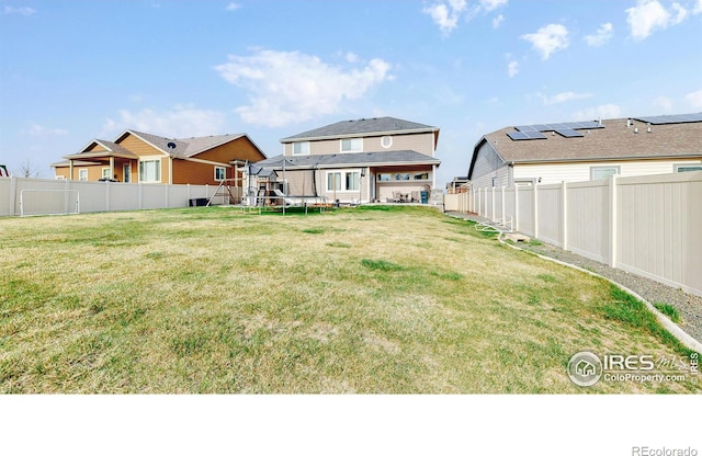 view of yard with a trampoline