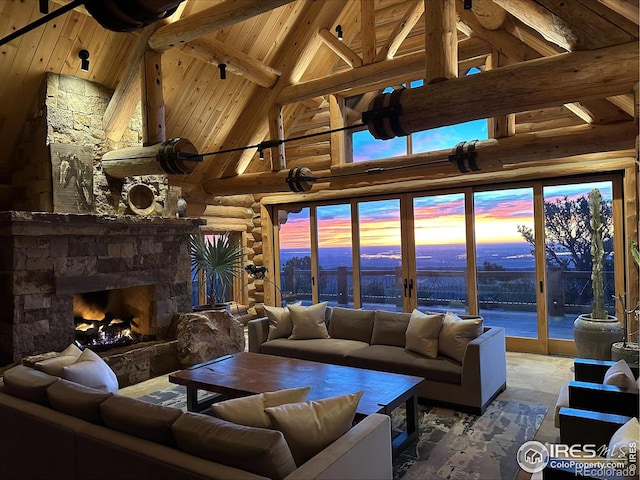 living room featuring beam ceiling, wood ceiling, a fireplace, high vaulted ceiling, and rustic walls