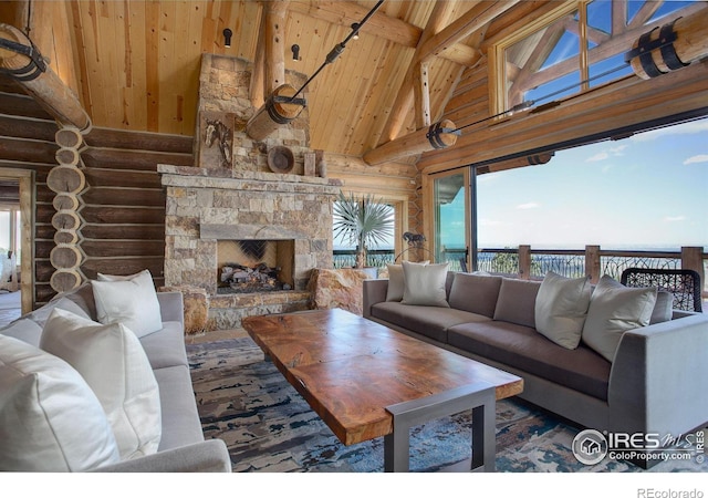 living room featuring an outdoor stone fireplace, rustic walls, high vaulted ceiling, wooden ceiling, and beam ceiling