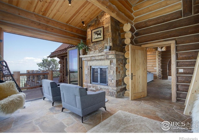 living room featuring an outdoor stone fireplace, log walls, wood ceiling, high vaulted ceiling, and beam ceiling