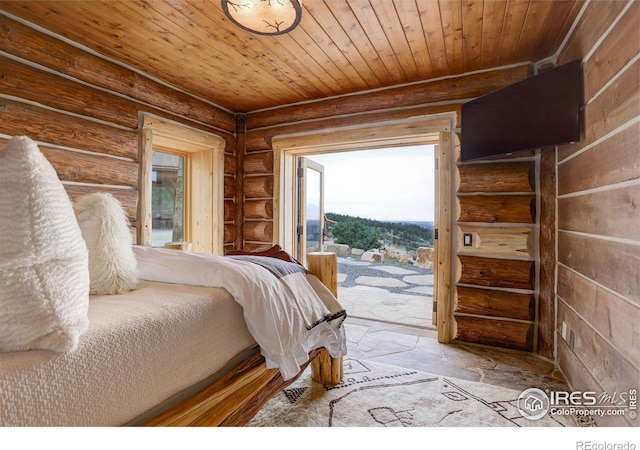 bedroom with access to exterior, rustic walls, and wooden ceiling