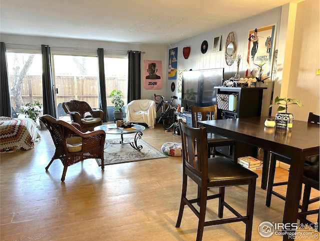 dining space with light hardwood / wood-style floors