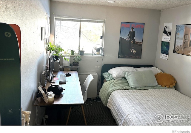 bedroom featuring a textured ceiling