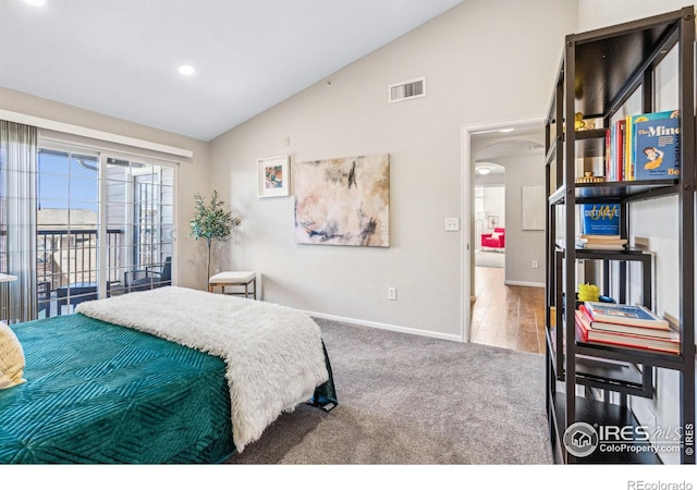 carpeted bedroom featuring vaulted ceiling and access to outside