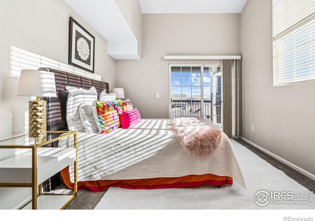 carpeted bedroom featuring access to exterior