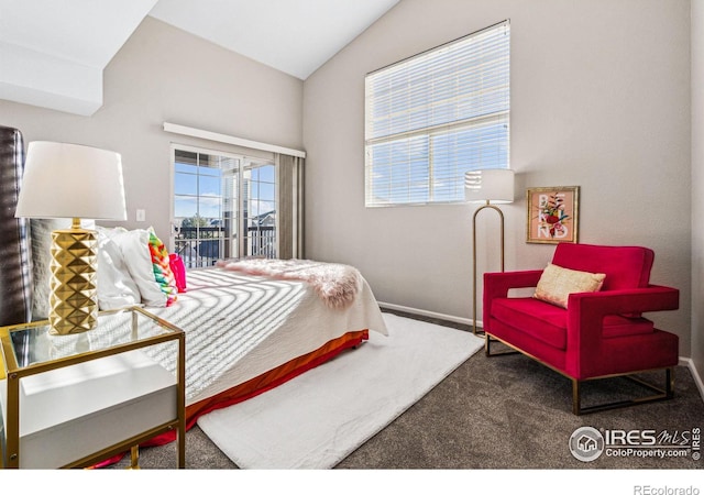 carpeted bedroom with vaulted ceiling and access to exterior