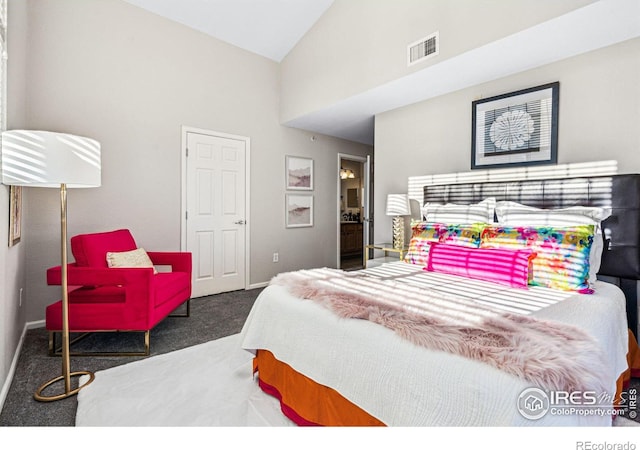 bedroom featuring high vaulted ceiling and dark carpet