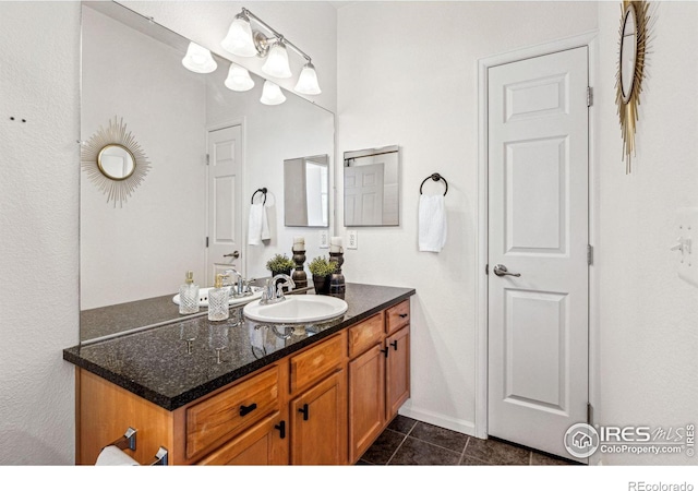 bathroom with vanity and tile patterned floors