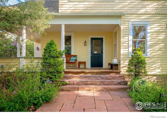 doorway to property with covered porch