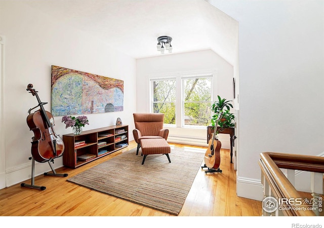 living area with hardwood / wood-style floors