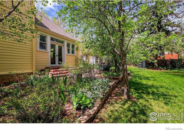 view of yard featuring french doors